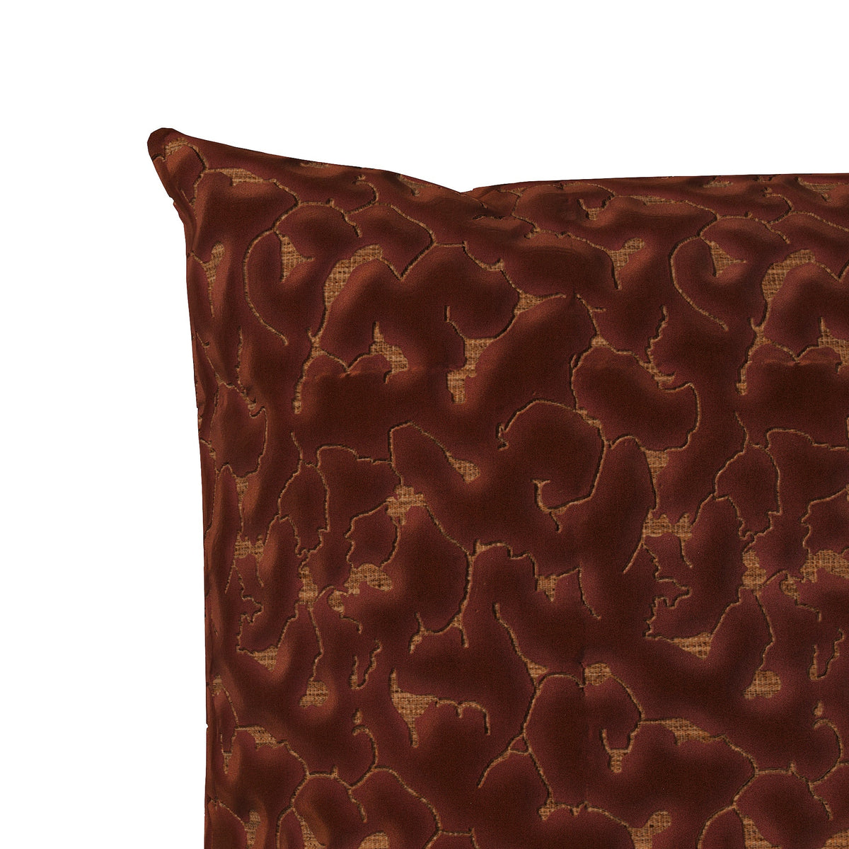 Copper colored throw pillow with an abstract texture.
